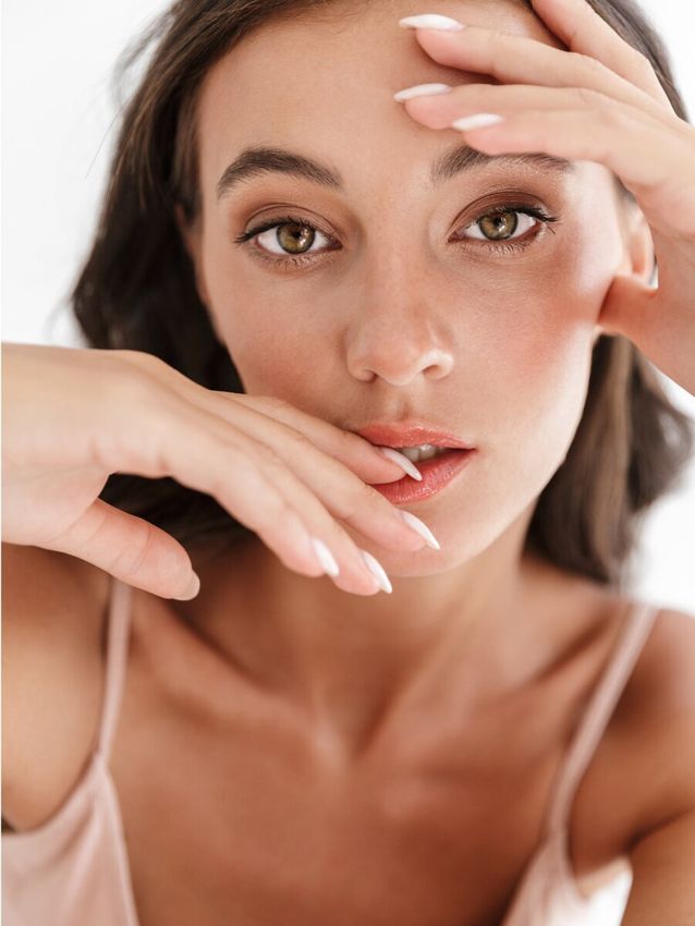 Close-up of woman with expressive facial features.